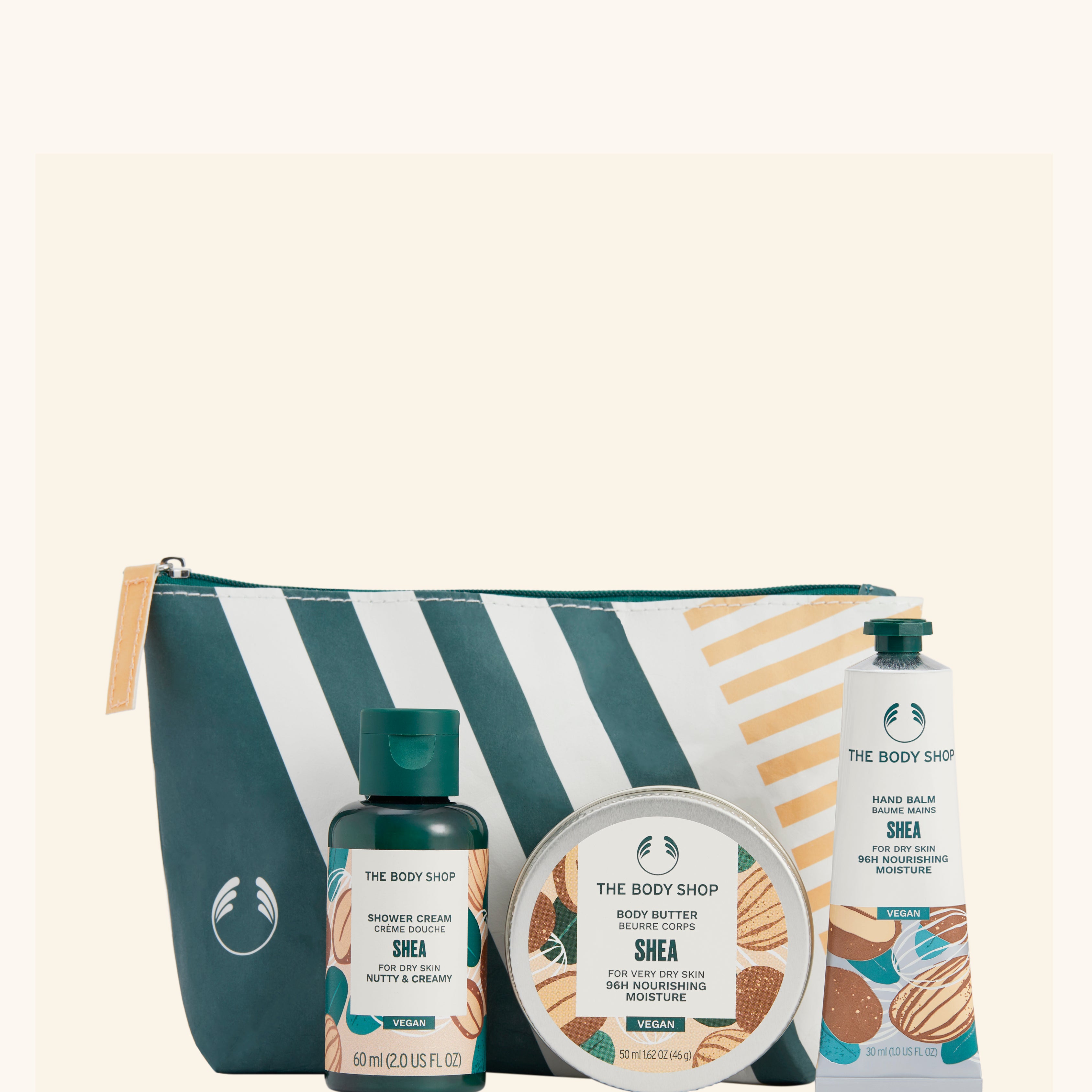 Presentförpackning med fyra Shea-produkter från The Body Shop i necessär.